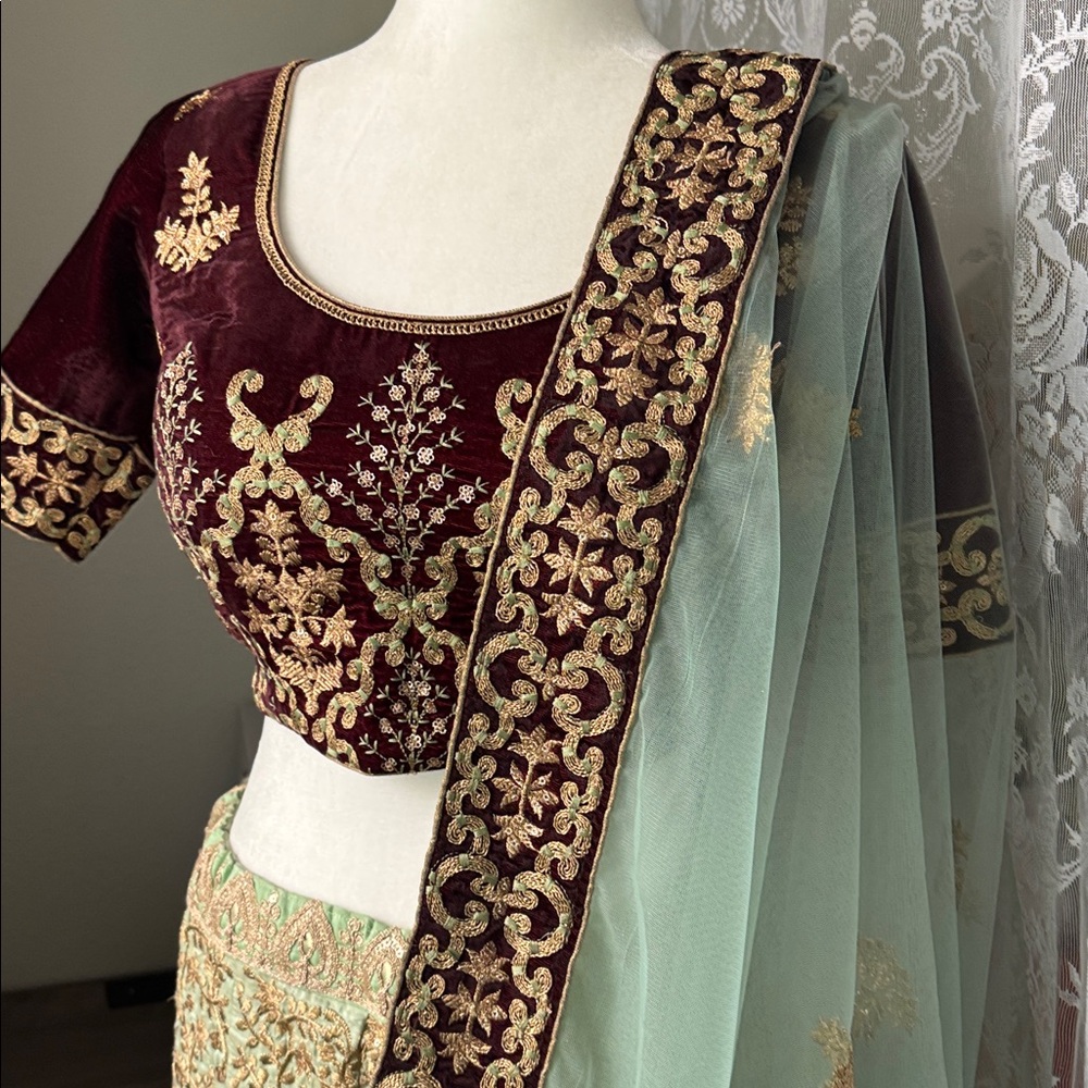 Deep burgundy gold and mint Lehenga set with dupatta
